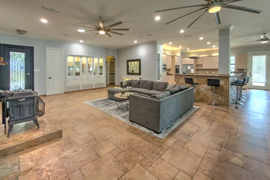 Wide view of the great room from the wood stove towards the kitchen