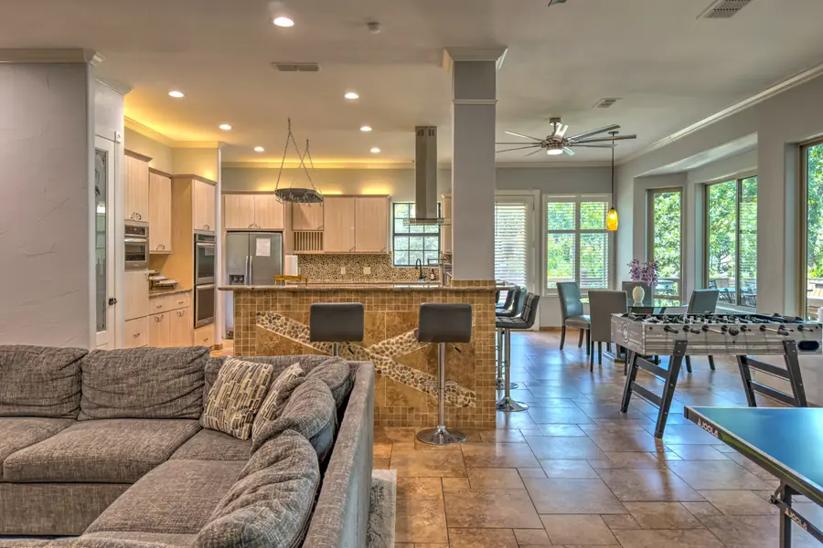 Breakfast bar with stools between the living room and kitchen